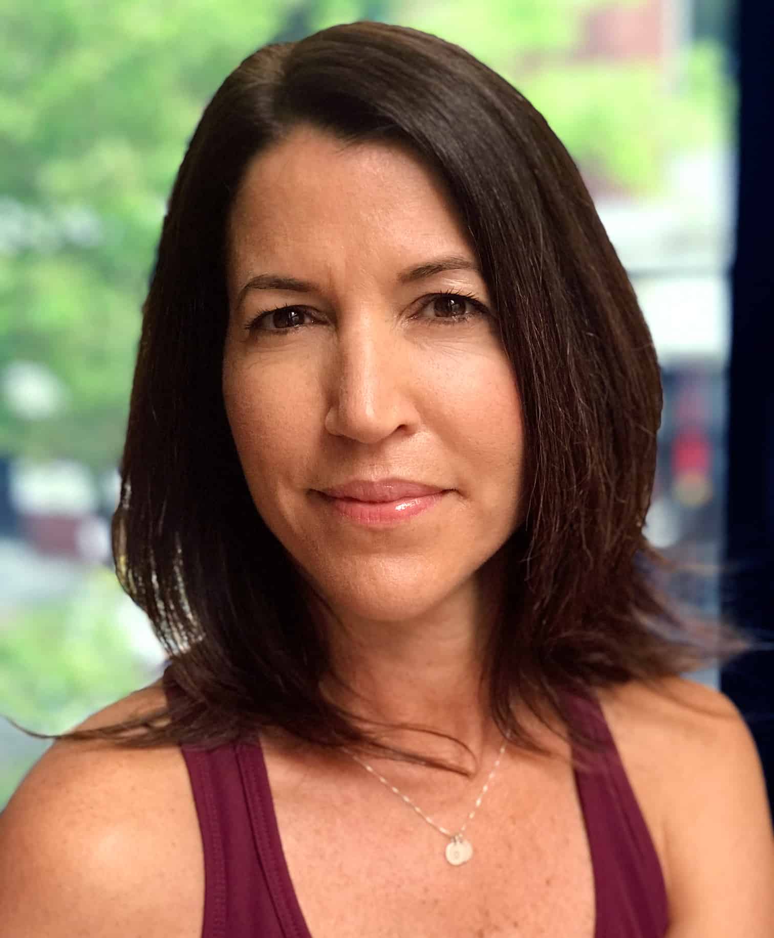 Pilates trainer, Claudia Galvao-Hayes, Portrait in Streamline Pilates Studio
