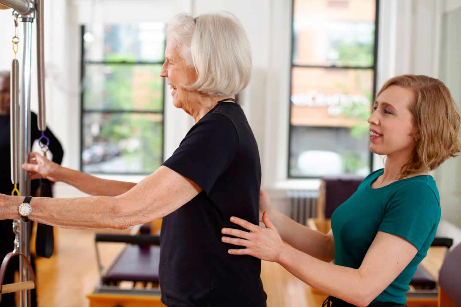 Reduce the risk of dementia with Pilates. Client balancing on one leg.